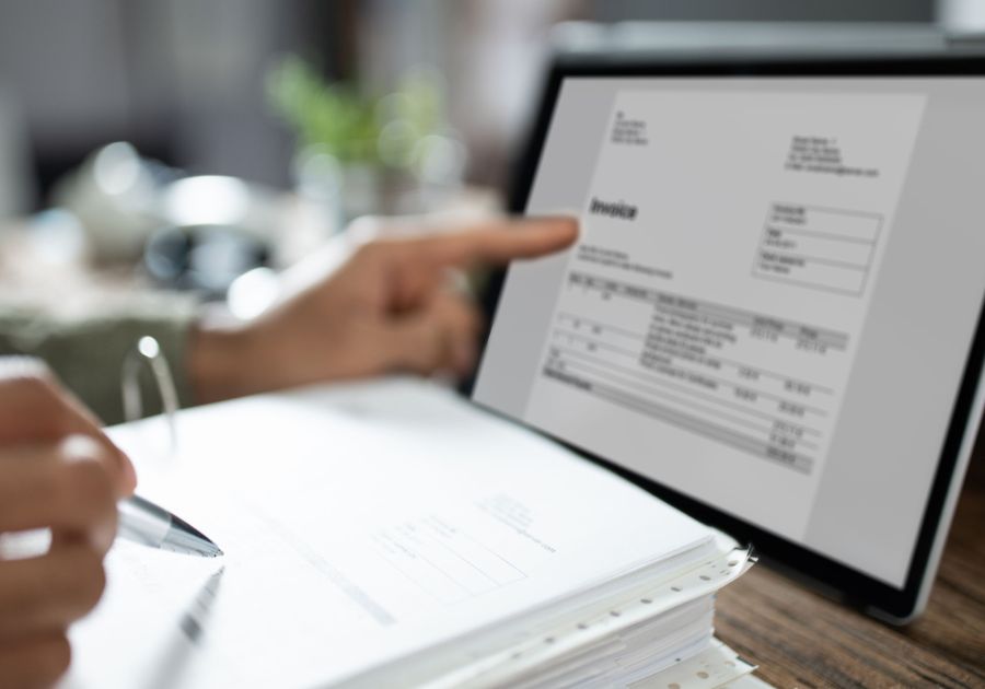 Lawyer Creating an Invoice on a Tablet