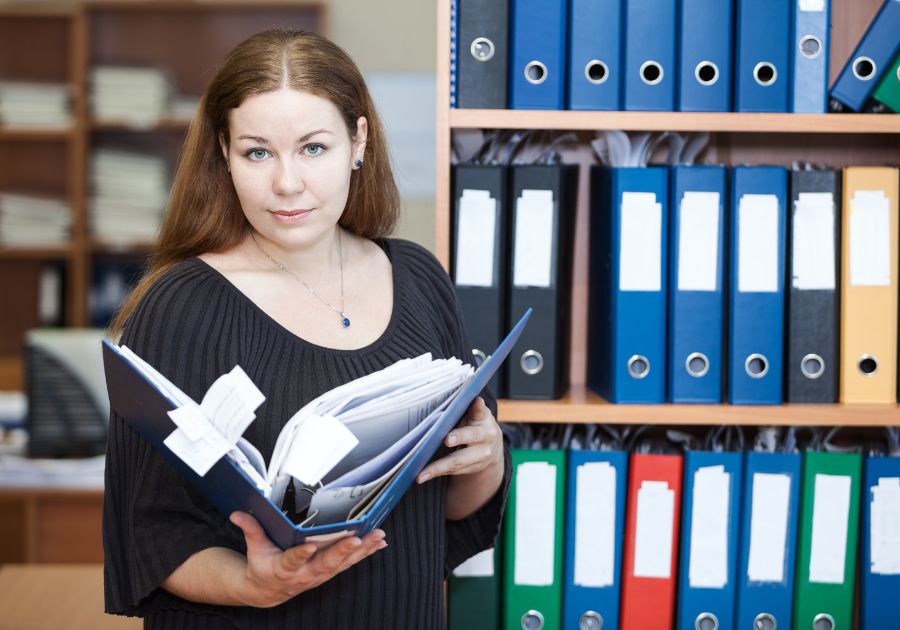 Lawyer Holding a Binder Containing Legal Billing Guidelines