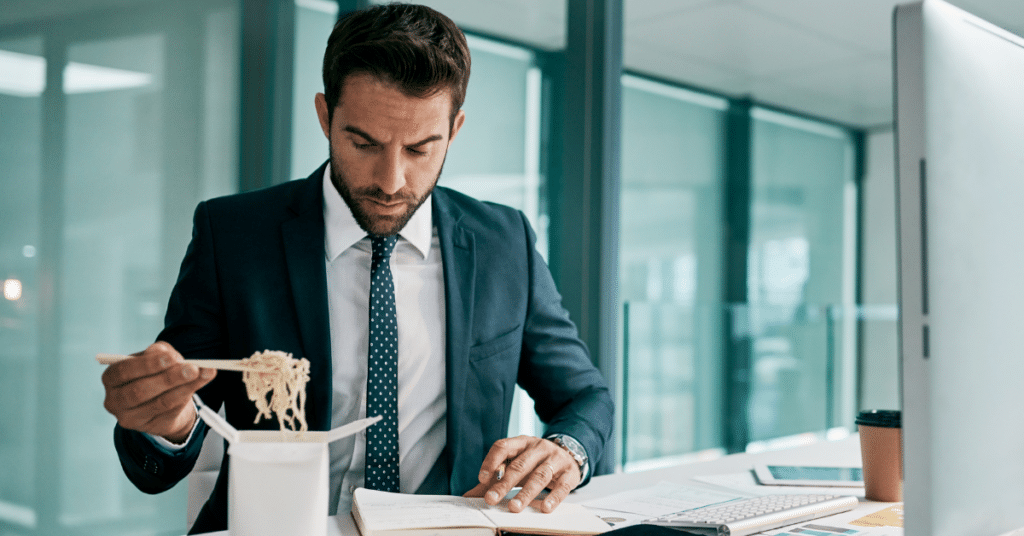 Person multitasking at desk