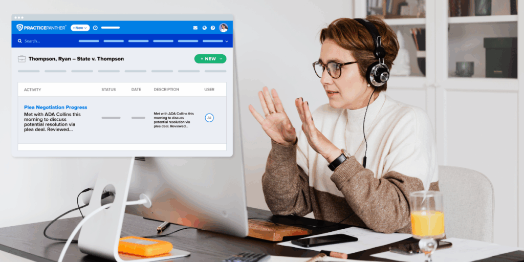 Female lawyer at her desk looking at a case dashboard on PracticePanther's platform