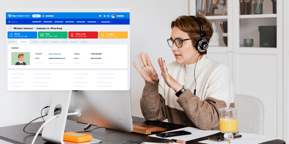 A female lawyer on a virtual call with a client, using PracticePanther matter management software to review their case