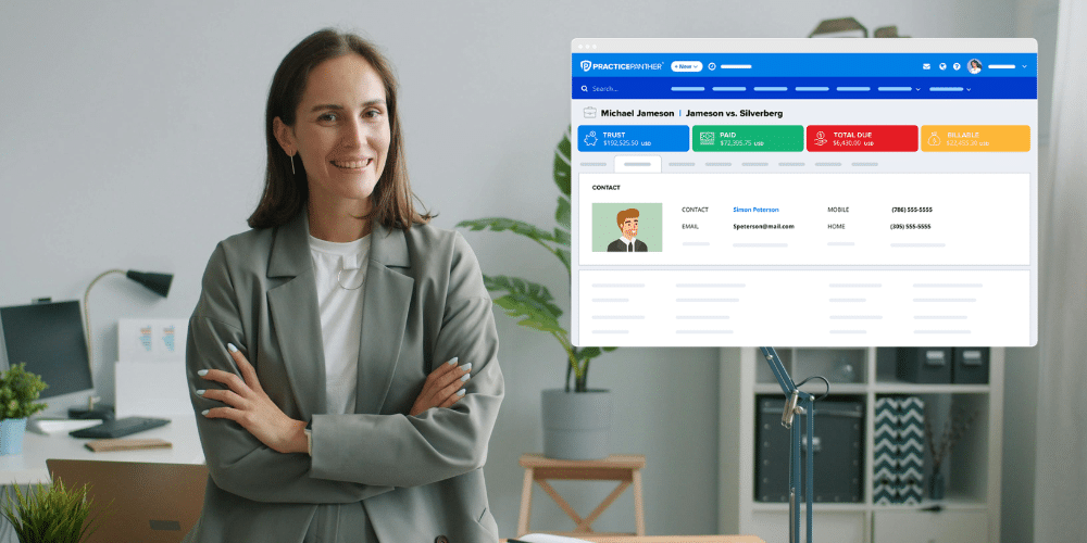 A woman lawyer smiling and reviewing case progress in PracticePanther